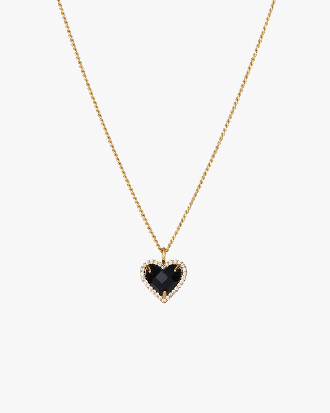 Gold chain necklace with a heart-shaped black gemstone pendant, surrounded by small clear crystals, on a white background. Elegant jewelry accessory.