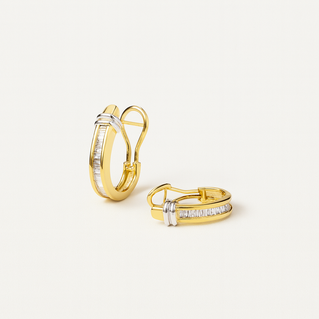 Gold hoop earrings with baguette-cut diamonds and silver accents, elegant jewelry design, luxury accessories, perfect for formal occasions.