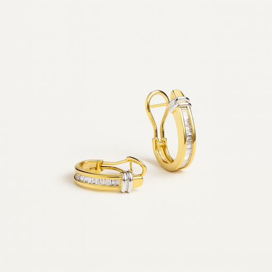 Gold hoop earrings with baguette-cut diamonds and secure latch back closure, elegant jewelry design, perfect for formal occasions.