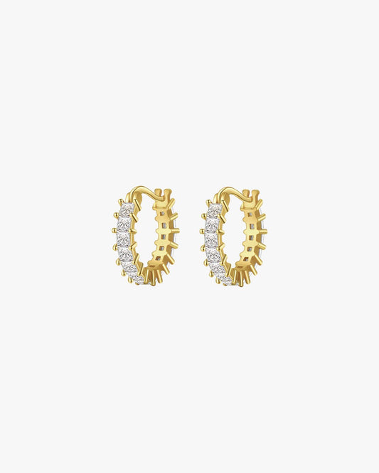 Gold hoop earrings with sparkling diamonds, elegant jewelry accessory, luxury fashion statement, perfect for special occasions and everyday wear.