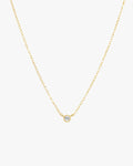 Gold chain necklace with a single diamond pendant, minimalist jewelry design, elegant and simple accessory for women, perfect for everyday wear.