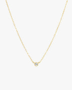 Gold chain necklace with a single diamond pendant, minimalist jewelry design, elegant and simple accessory for women, perfect for everyday wear.