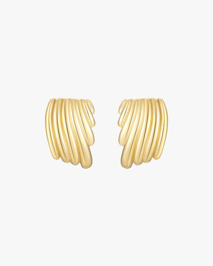 Gold ribbed hoop earrings on white background, elegant jewelry, textured design, fashion accessories, women's gold earrings, stylish statement piece.