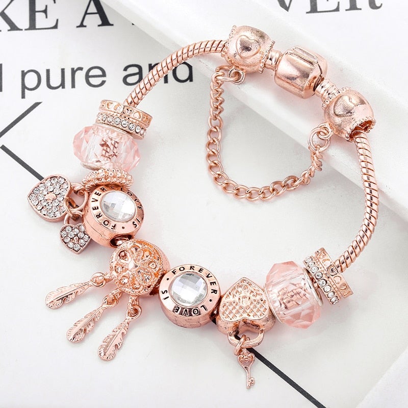 Rose-Tone Charm Bracelet with Beads and Dangling Accents