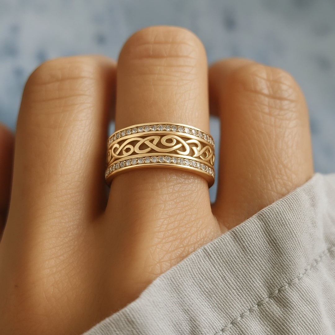Gold Celtic knot ring with diamond accents on a finger, close-up. Elegant jewelry design, intricate detailing, perfect for weddings or special occasions.
