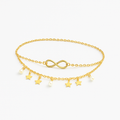 Gold infinity anklet with star and pearl charms, delicate chain, elegant jewelry accessory, perfect for fashion-forward style and gift ideas.