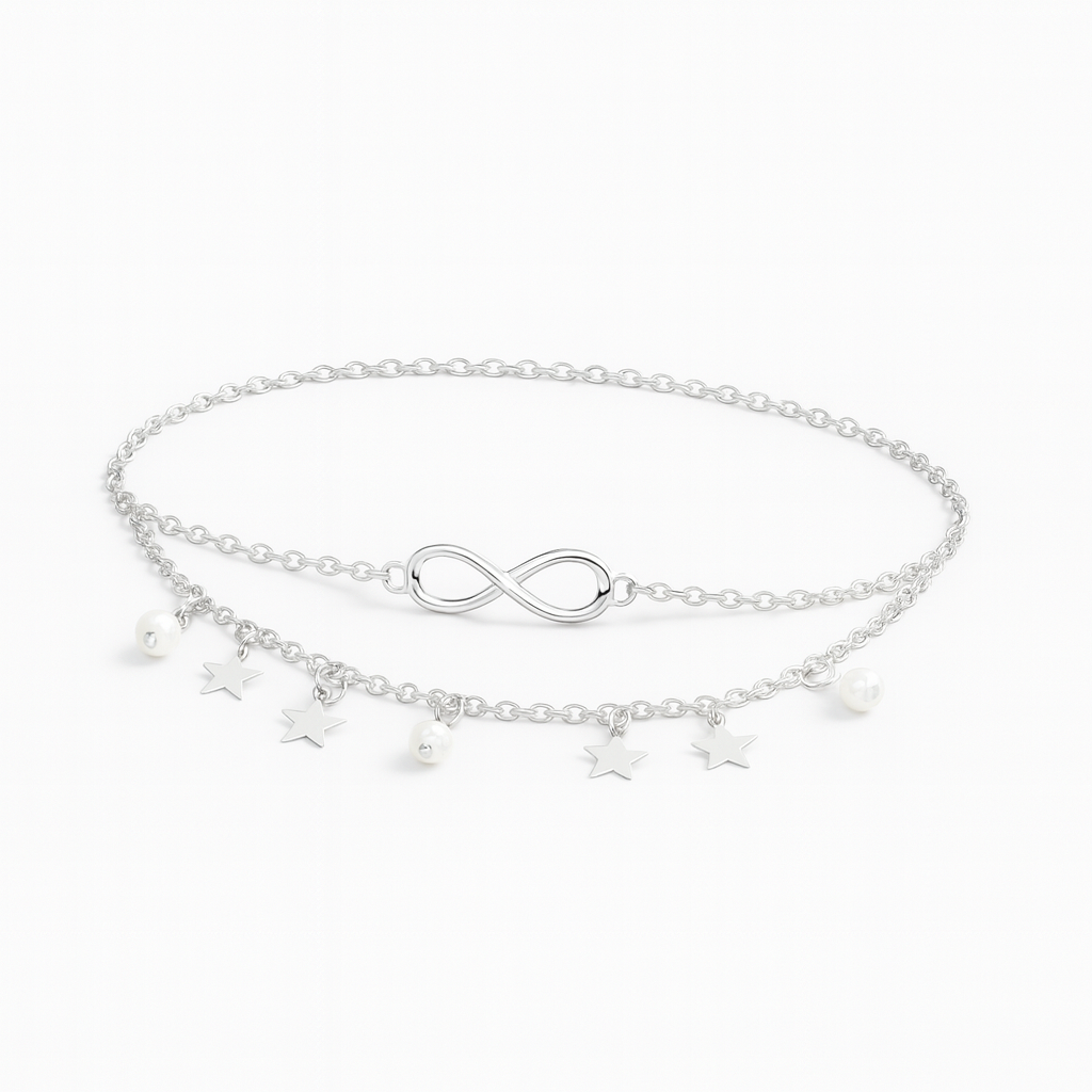 Silver infinity anklet with star and pearl charms, double chain design, elegant jewelry accessory, perfect for fashion-forward styling.