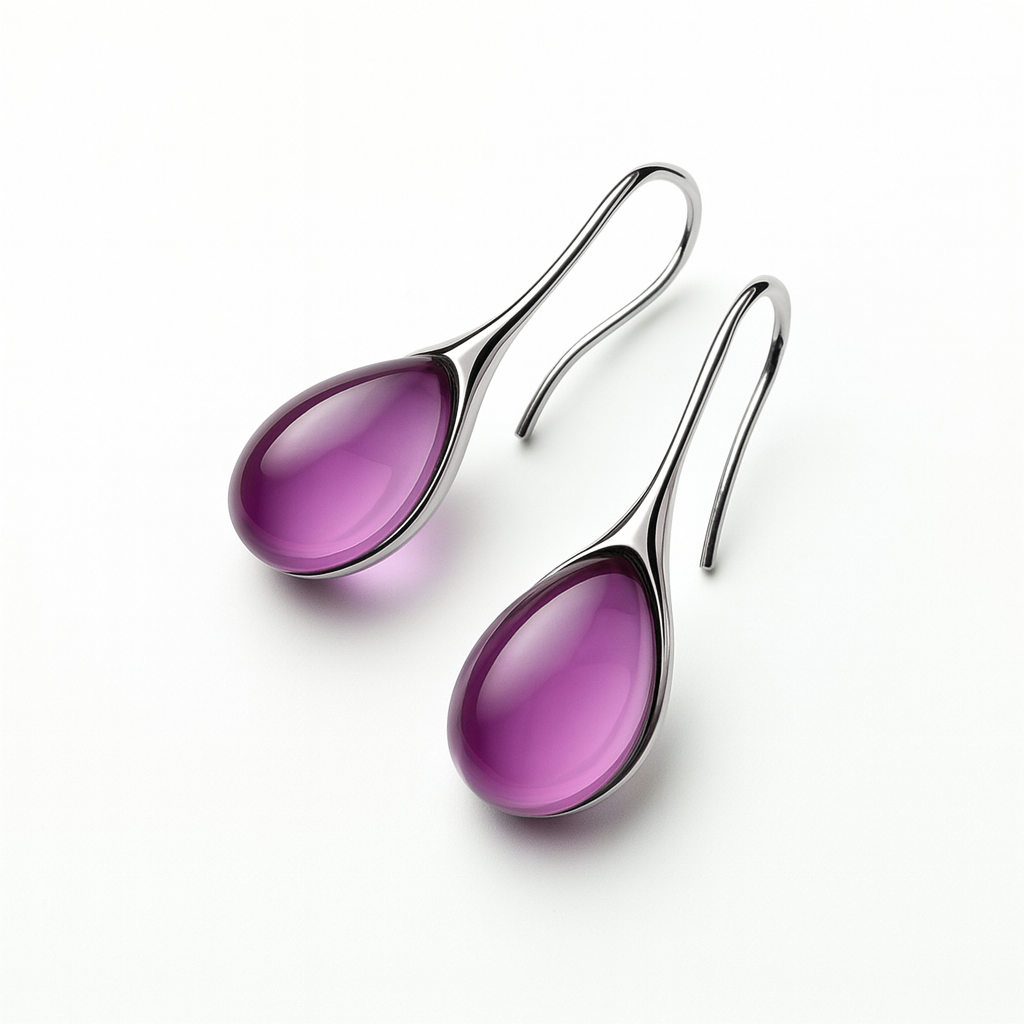 Elegant silver hook earrings with glossy purple teardrop gemstones, isolated on a white background. Fashion jewelry, stylish accessories.
