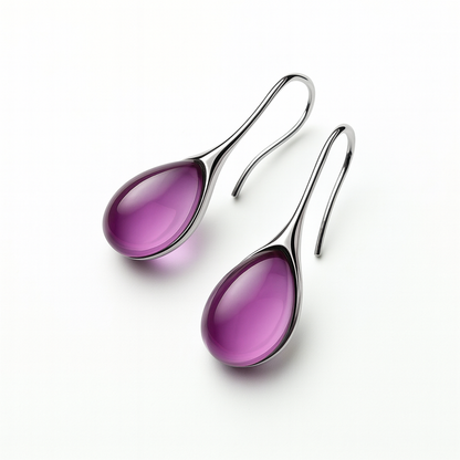Elegant silver hook earrings with glossy purple teardrop gemstones, isolated on a white background. Fashion jewelry, stylish accessories.