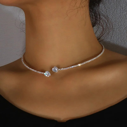 Elegant diamond choker necklace on woman's neck, featuring two sparkling gemstones, perfect for luxury fashion and jewelry enthusiasts.