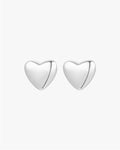 Silver heart-shaped stud earrings on a white background, minimalist jewelry design, perfect for everyday wear, elegant and timeless accessory.