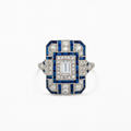 Art Deco style ring with blue and white gemstones on a white background