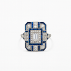 Art Deco style ring with blue and white gemstones on a white background