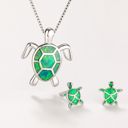 Turtle jewelry set with green opal inlay, featuring a silver turtle pendant necklace and matching earrings, perfect for ocean-themed fashion.