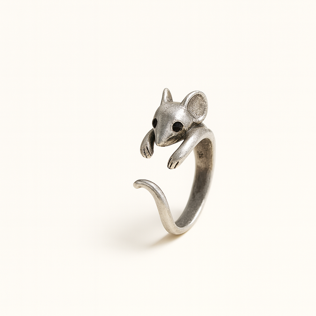 Silver mouse-shaped ring on a white background