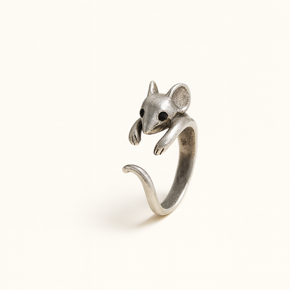 Silver mouse-shaped ring on a white background