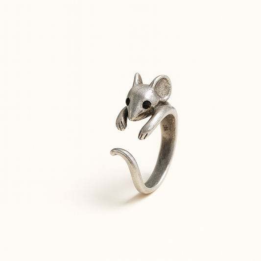 Silver mouse-shaped ring on a white background