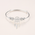 Silver dreamcatcher charm bracelet with intricate feather pendants, elegant design, perfect for boho fashion, women's jewelry accessory.