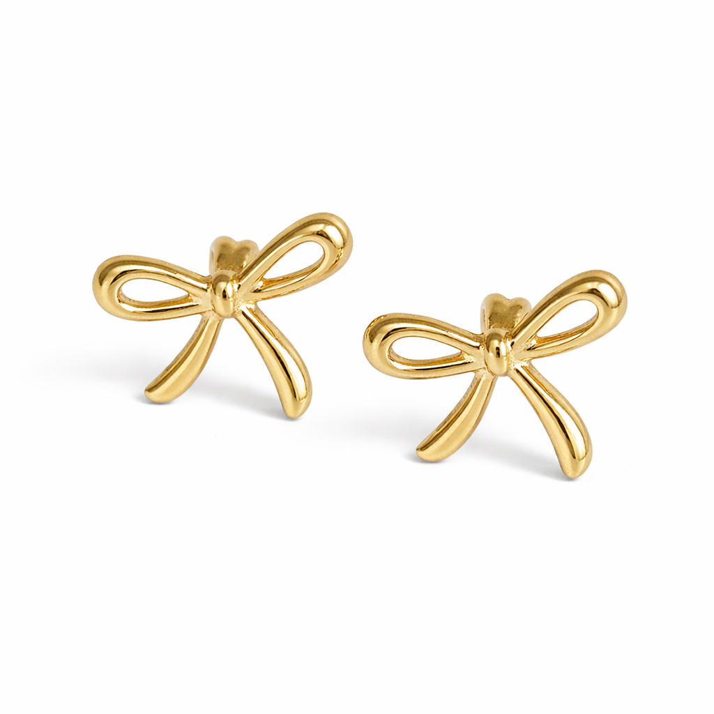 Gold bow-shaped earrings on a white background