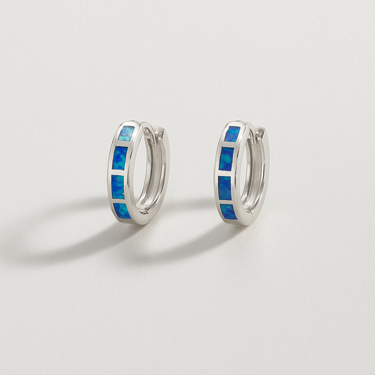 Silver hoop earrings with blue opal inlay, minimalist jewelry design, elegant fashion accessory, perfect for stylish outfits and gift ideas.