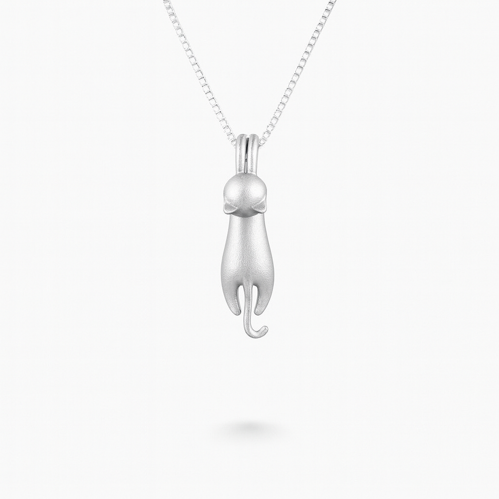 Silver cat pendant necklace on a delicate chain, minimalist feline jewelry design, perfect for cat lovers and fashion enthusiasts.