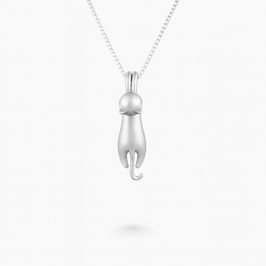 Silver cat pendant necklace on a delicate chain, minimalist feline jewelry design, perfect for cat lovers and fashion enthusiasts.