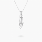 Silver cat pendant necklace on a delicate chain, minimalist jewelry design, perfect for cat lovers, elegant accessory for everyday wear.