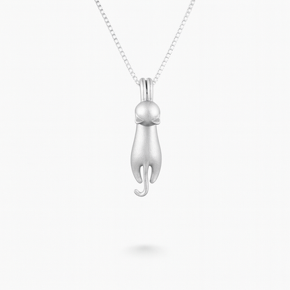 Silver cat pendant necklace on a delicate chain, minimalist jewelry design, perfect for cat lovers, elegant accessory for everyday wear.