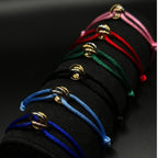 Set of colorful bracelets on a black background