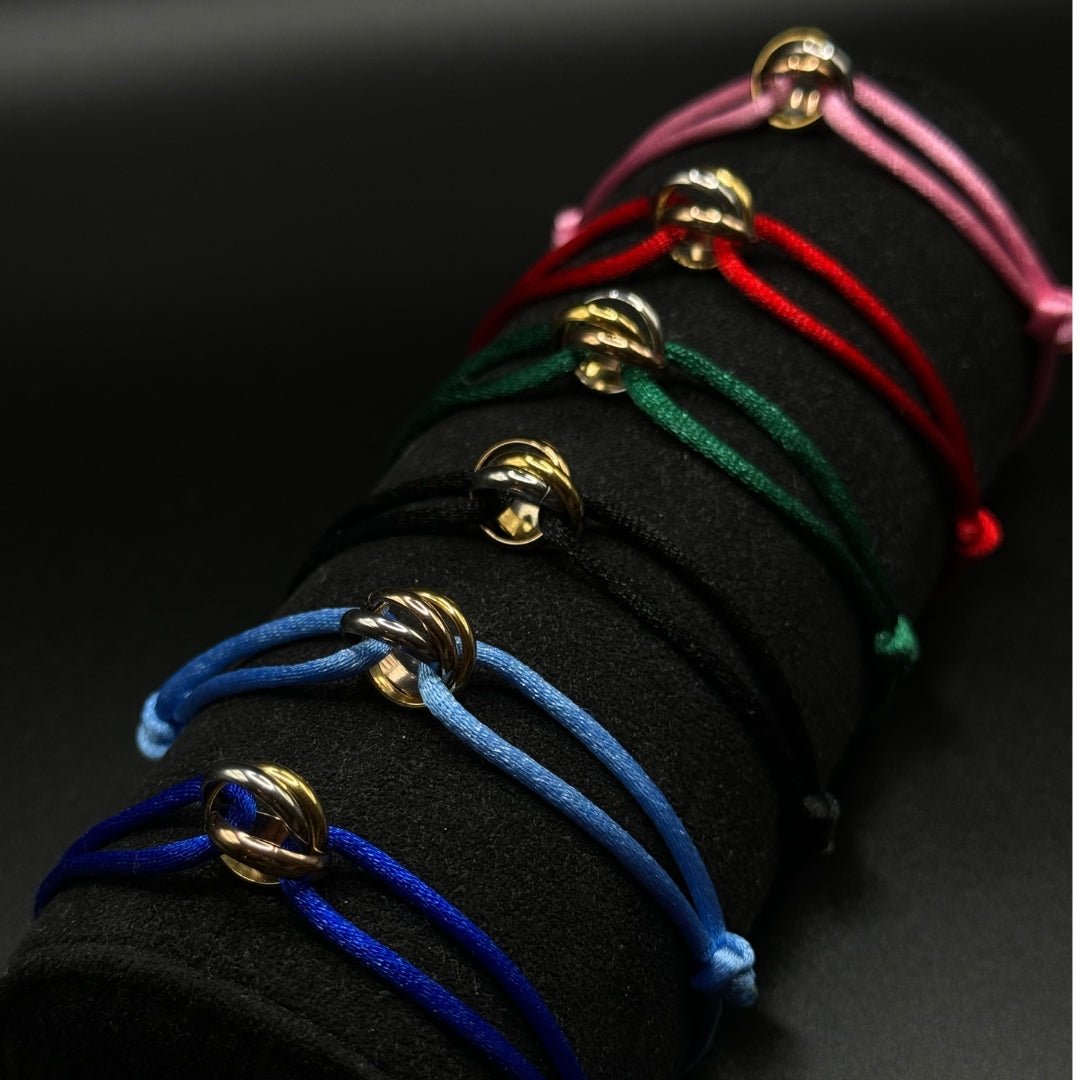 Set of colorful bracelets on a black background