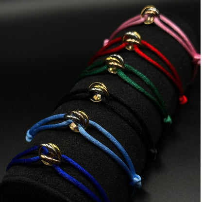 Set of colorful bracelets on a black background