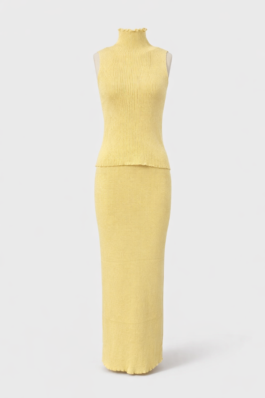 Yellow sleeveless top and skirt set on a white background