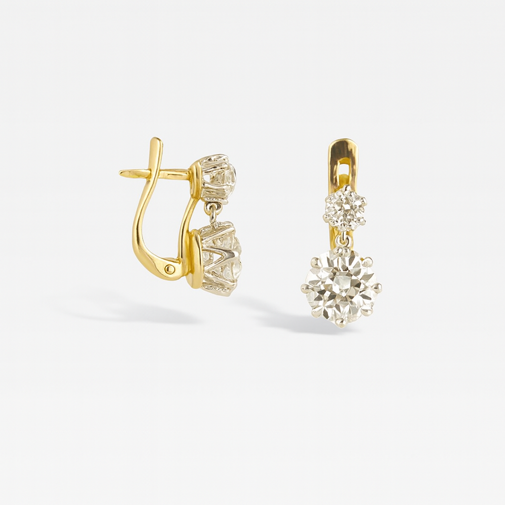 Gold drop earrings with sparkling round diamonds, featuring a secure latch back closure. Elegant jewelry piece for weddings or special occasions.