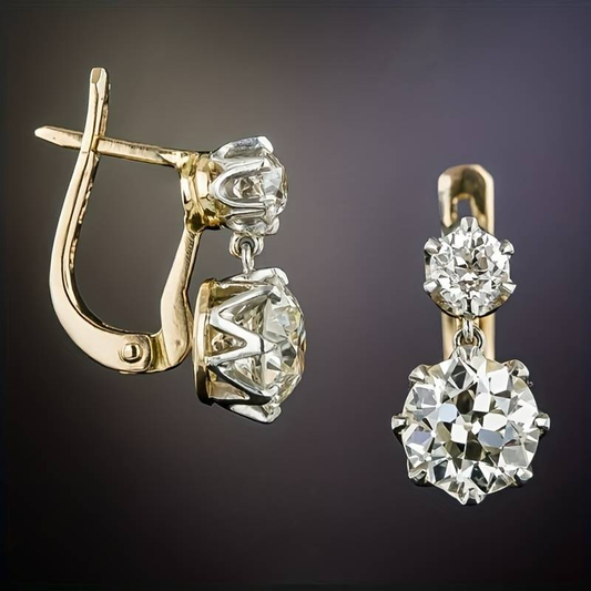 Gold diamond drop earrings with round brilliant-cut stones, elegant jewelry design, luxury accessories, sparkling gemstones, fashion statement.