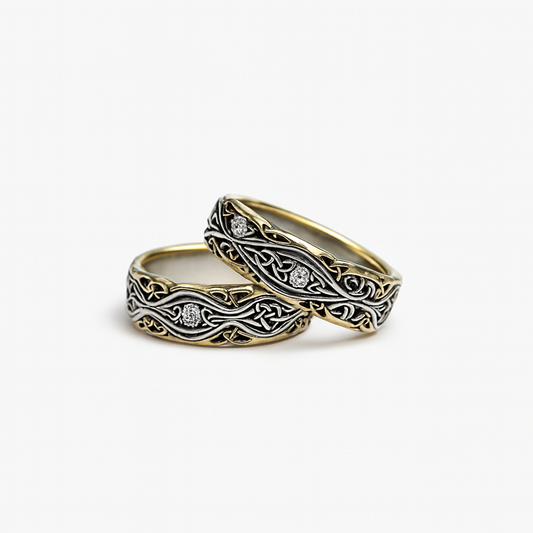 Two intricately designed rings on a white background