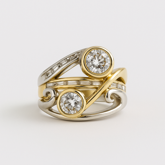 Gold and silver ring with two diamond stones on a light gray background