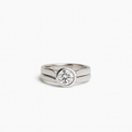 Silver ring with a diamond on a white background