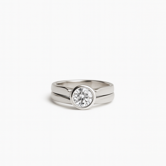 Silver ring with a diamond on a white background
