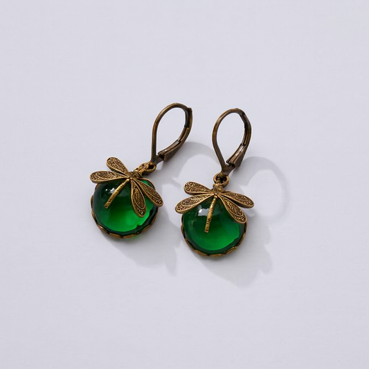 Vintage dragonfly earrings with green gemstone, antique bronze finish, leverback closure. Elegant jewelry, nature-inspired design, fashion accessory.