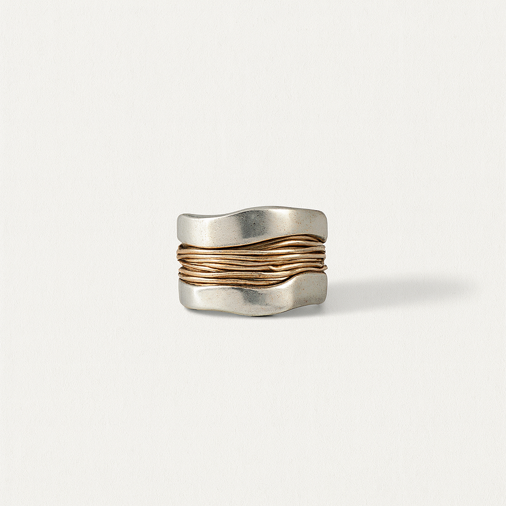 Wide silver ring with wavy design and gold accents, minimalist jewelry, modern fashion accessory, elegant unisex ring, unique statement piece.