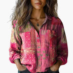 Woman wearing a pink plaid shirt with a neutral background