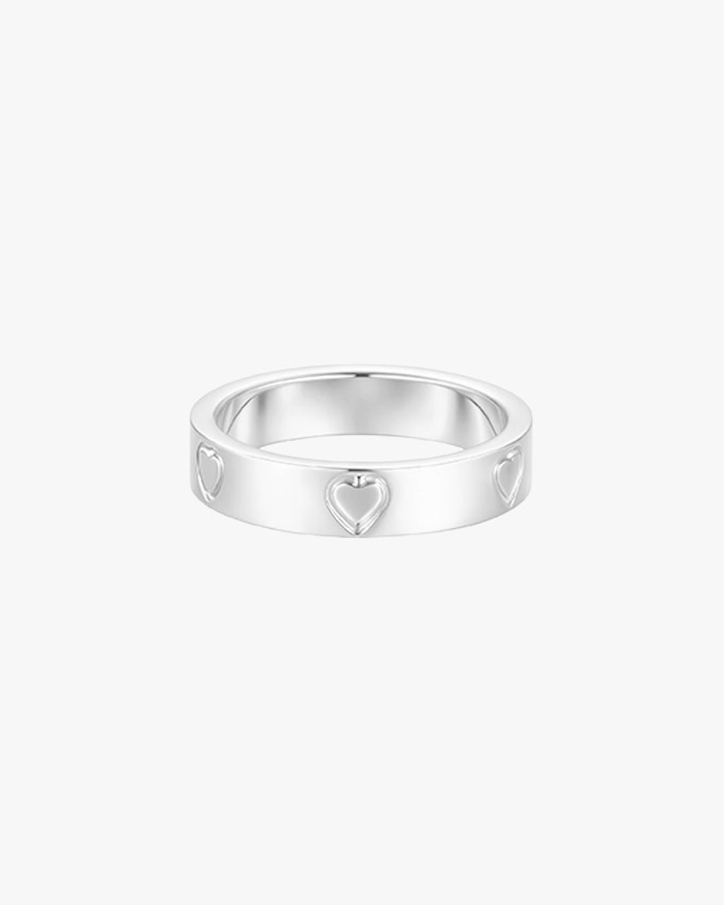 Silver heart-embossed ring on white background, minimalist jewelry, elegant design, perfect for gifts, women's fashion accessory.