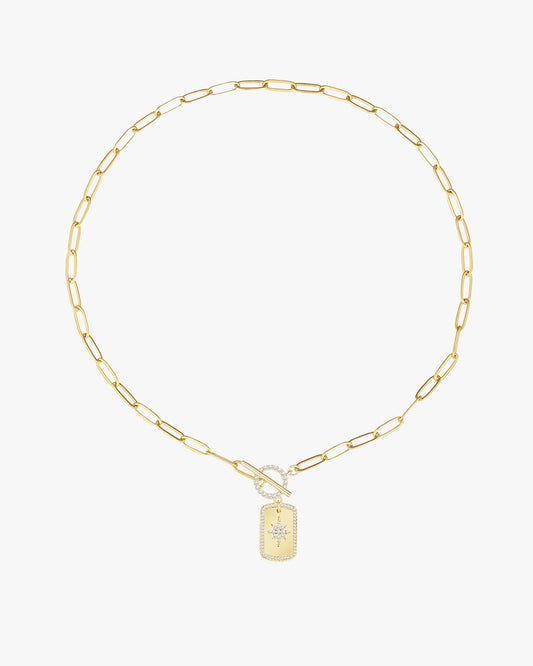 Gold chain necklace with a rectangular diamond-studded pendant featuring a star design, elegant jewelry accessory, luxury fashion statement piece.