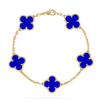 Gold chain bracelet with five blue clover-shaped charms, featuring diamond accents. Elegant jewelry piece, luxury fashion accessory.