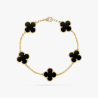 Gold bracelet with five black clover-shaped charms, elegant chain design, luxury jewelry, fashion accessory, Van Cleef & Arpels style.