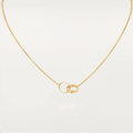 Gold necklace with interlocking rings pendant on a white background. Elegant jewelry piece, perfect for weddings or anniversaries.