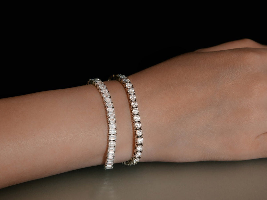 Elegant diamond tennis bracelets on wrist, showcasing luxury jewelry design. Sparkling gemstones, perfect for fashion and style enthusiasts.