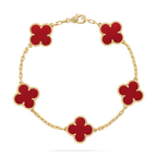 Gold bracelet with five red clover-shaped charms, luxury jewelry, elegant design, Van Cleef & Arpels style, fashion accessory, high-end craftsmanship.