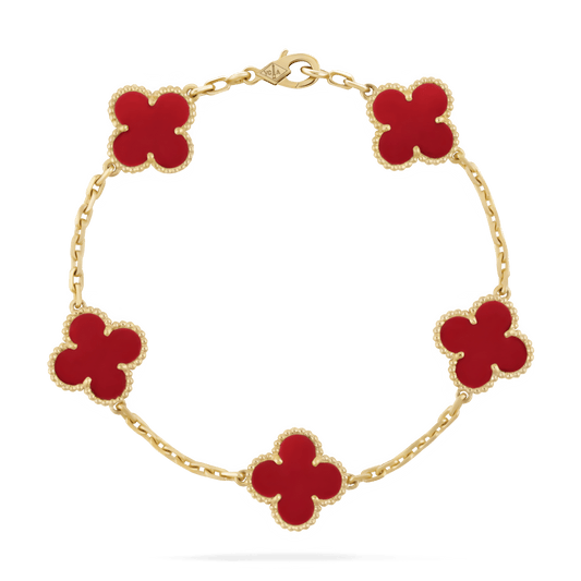 Gold bracelet with five red clover-shaped charms, luxury jewelry, elegant design, Van Cleef & Arpels style, fashion accessory, high-end craftsmanship.