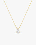 Gold chain necklace with a pear-shaped diamond pendant, minimalist jewelry design, elegant and timeless accessory for fashion and style enthusiasts.